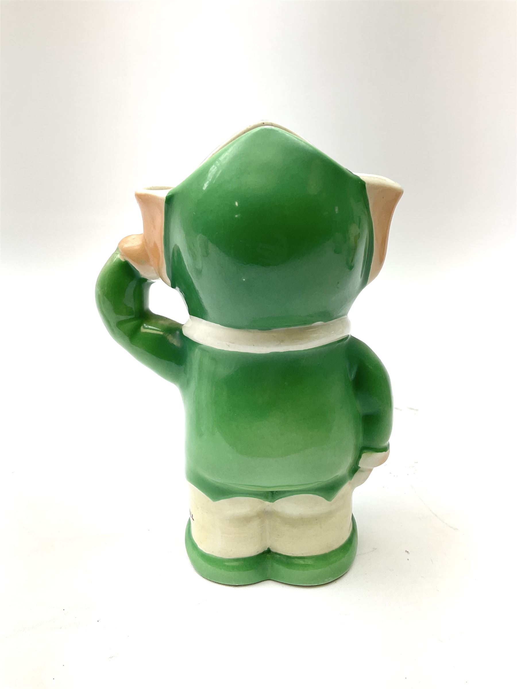 Shelley Boo Boo three piece tea set designed by Mabel Lucie Attwell, comprising teapot modelled as a house, sugar bowl modelled as a toadstool, and creamer modelled as an elf, each with printed marks beneath, together with a Shelley Mabel Lucie Attwell teacup and saucer. 