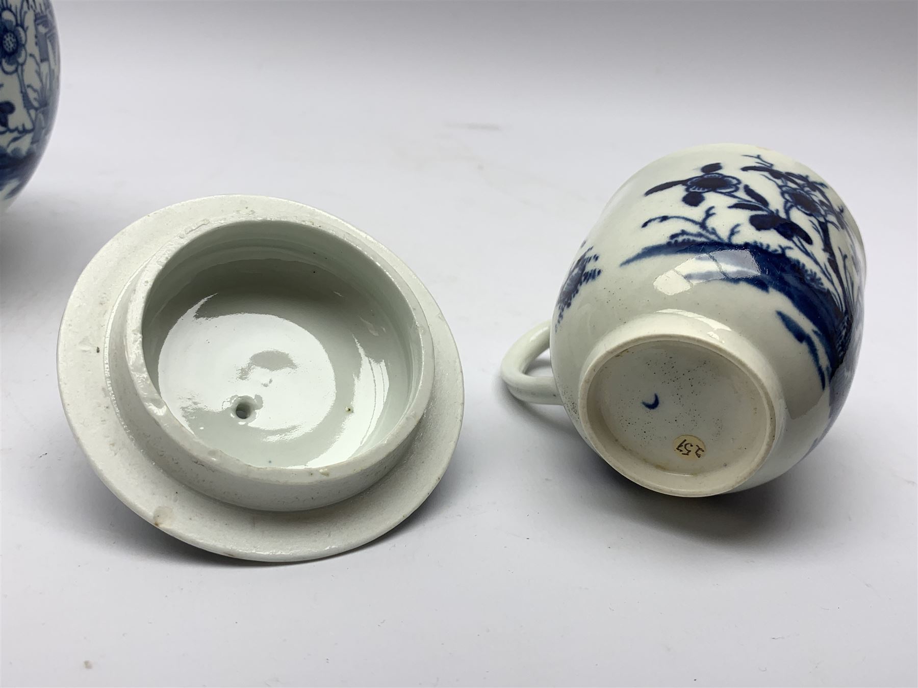 18th Century Worcester teapot, circa 1765-70, decorated in the Bird in the ring pattern, the cover with bud finial, with crescent mark beneath, H13cm, together with a Worcester coffee cup decorated in the same pattern, with crescent mark beneath, H6.5cm