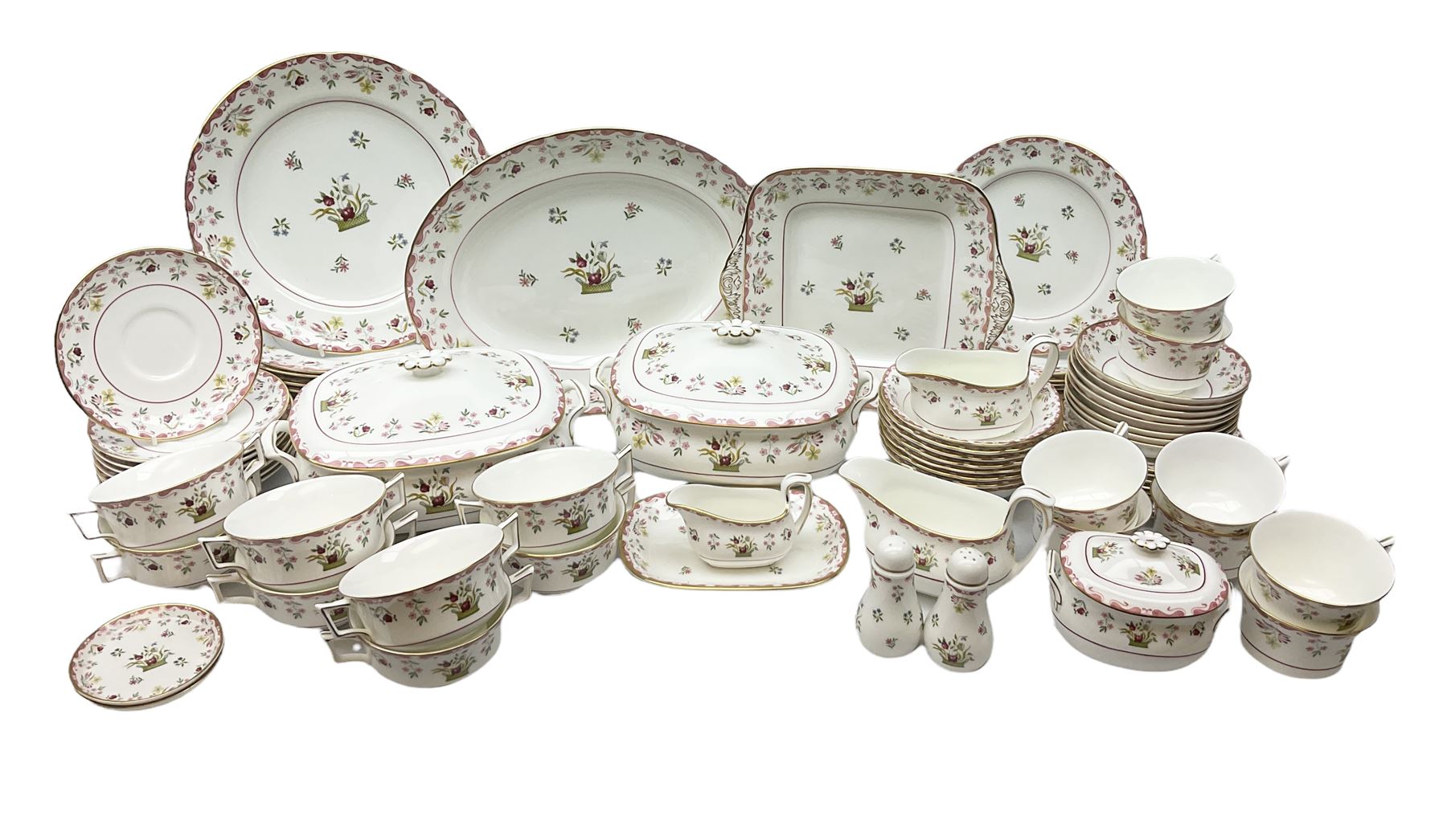 Wedgwood dinner service decorated in the 'Bianca' pattern, to include eight dinner plates, eight bowls, eight side plates, eight twin handled souo bowls, eight soup bowl saucers, eight teacups, eight teacup saucers, six dessert plates and two larger, two twin handled lidded tureens, milk jug, two sauce boats, salt and pepper shakers, oval serving  plate, twin handled sandwich plate, covered sucrier, small rectangular dish and two small circular dishes, all with printed stamp mark beneath