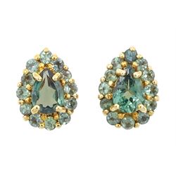Pair of 18ct gold green alexandrite cluster earrings, each stud set with a pear cut and tw...