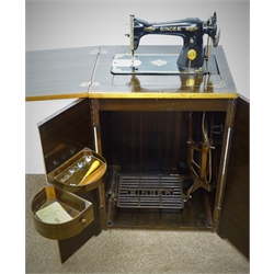  Mid 20th century treadle Singer sewing machine in walnut cabinet (W54cm, H79cm, D43cm) and a Pembroke mahogany table, turned supports (W100cm, H67cm, D86cm)  