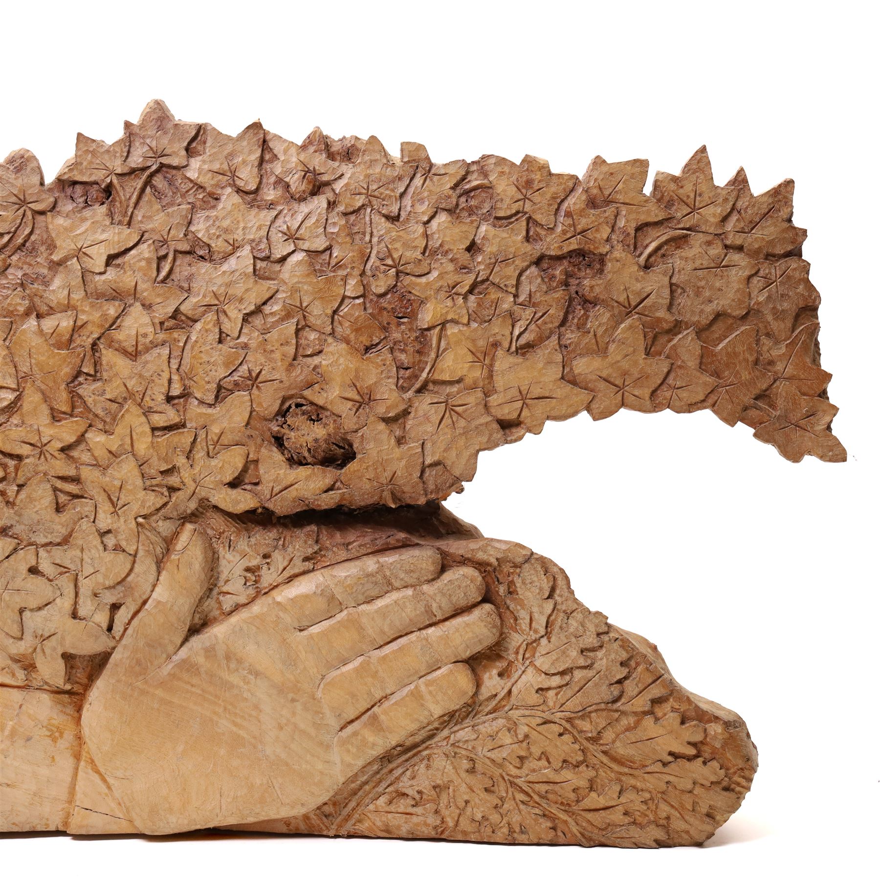 Ian Thompson (British 1947-): 'Green Man', sculpture carved from a single piece of figured burr elm signed and dated 1999 verso 50cm x 103cm