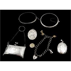 Early 20th century silver coin purse with finger chain, Birmigham 1915 and silver jewellery including two engraved bangles, two lockets and a charm bracelet 