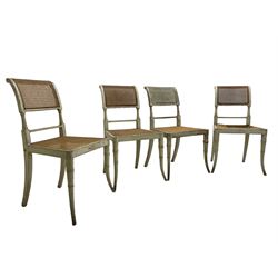 Collection of Regency dining chairs - set of four Regency painted beech dining chairs, with cane seat and back, on collar turned supports with splayed feet (W46cm, H84cm); a pair of Regency ebonised dining chairs (W47cm, H77cm); and a single Regency dining chair, the cresting rail painted with floral cornucopias and central putto vignette, X-frame back over cane seat, on collar turned front supports painted with foliage (W46cm, H84cm) (7)