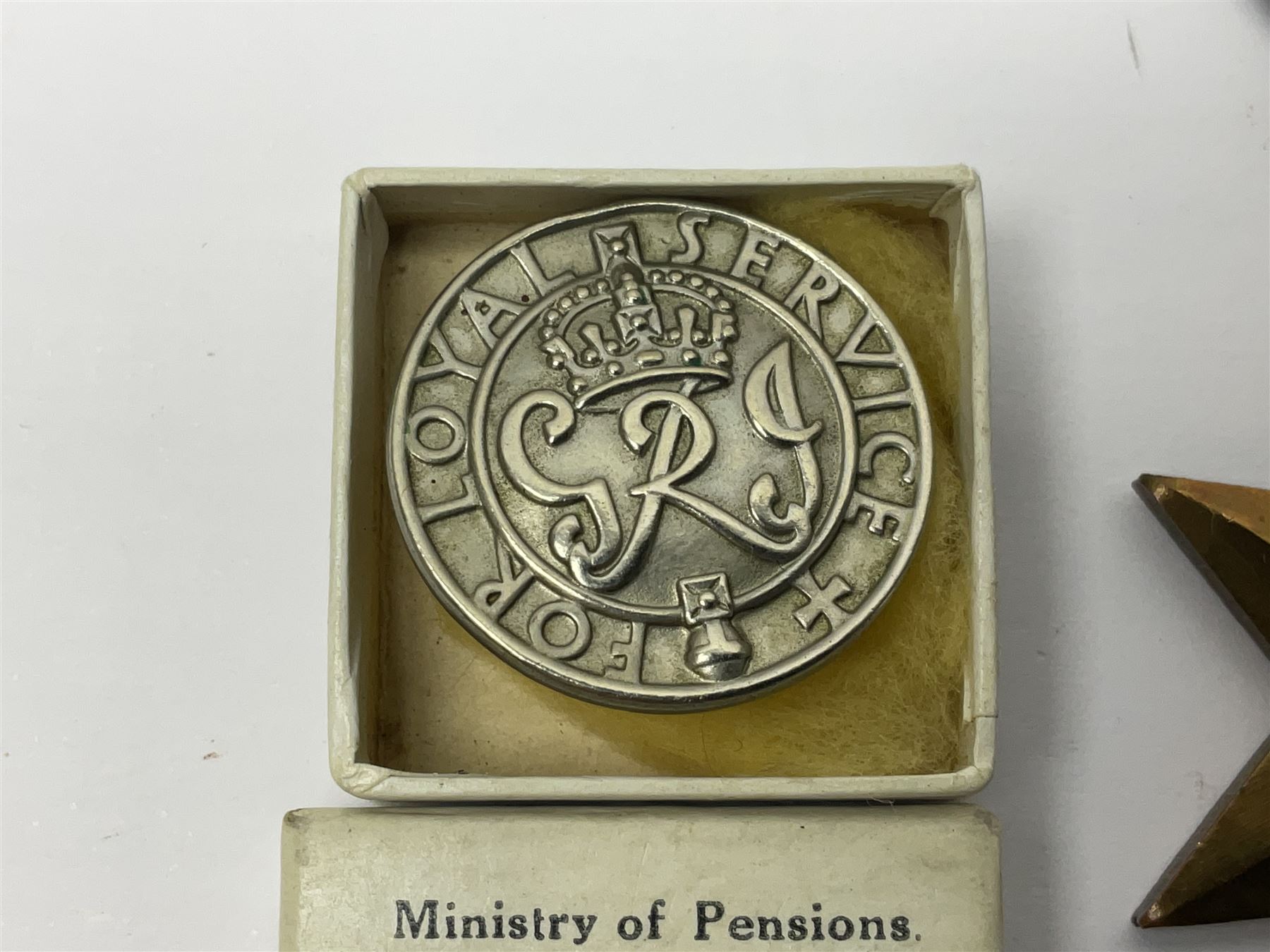 WWII group of five medals comprising 1939-45 War Medal, Defence Medal, 1939-45 Star, Africa Star and France and Germany Star on wearing bar; WWI British War Medal awarded to 142019 Pte. A. Thompson A.S.C.; and boxed King's Badge 'For Loyal Service'