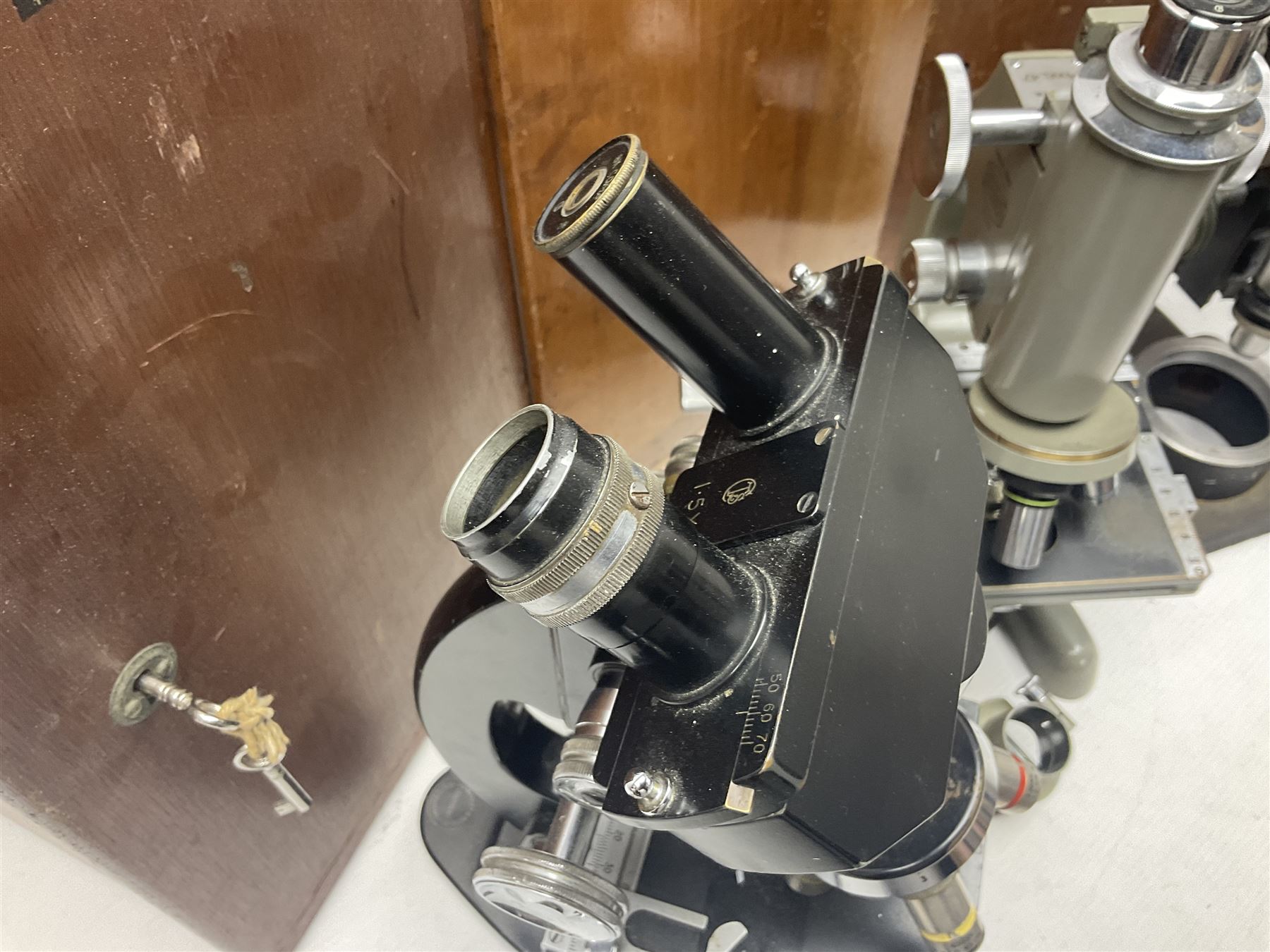 Four microscopes, including Cooke, Troughton & Simms no M467926, W Watson & Sons no 114758, W & J George & Beck Ltd no 36649 and one other 