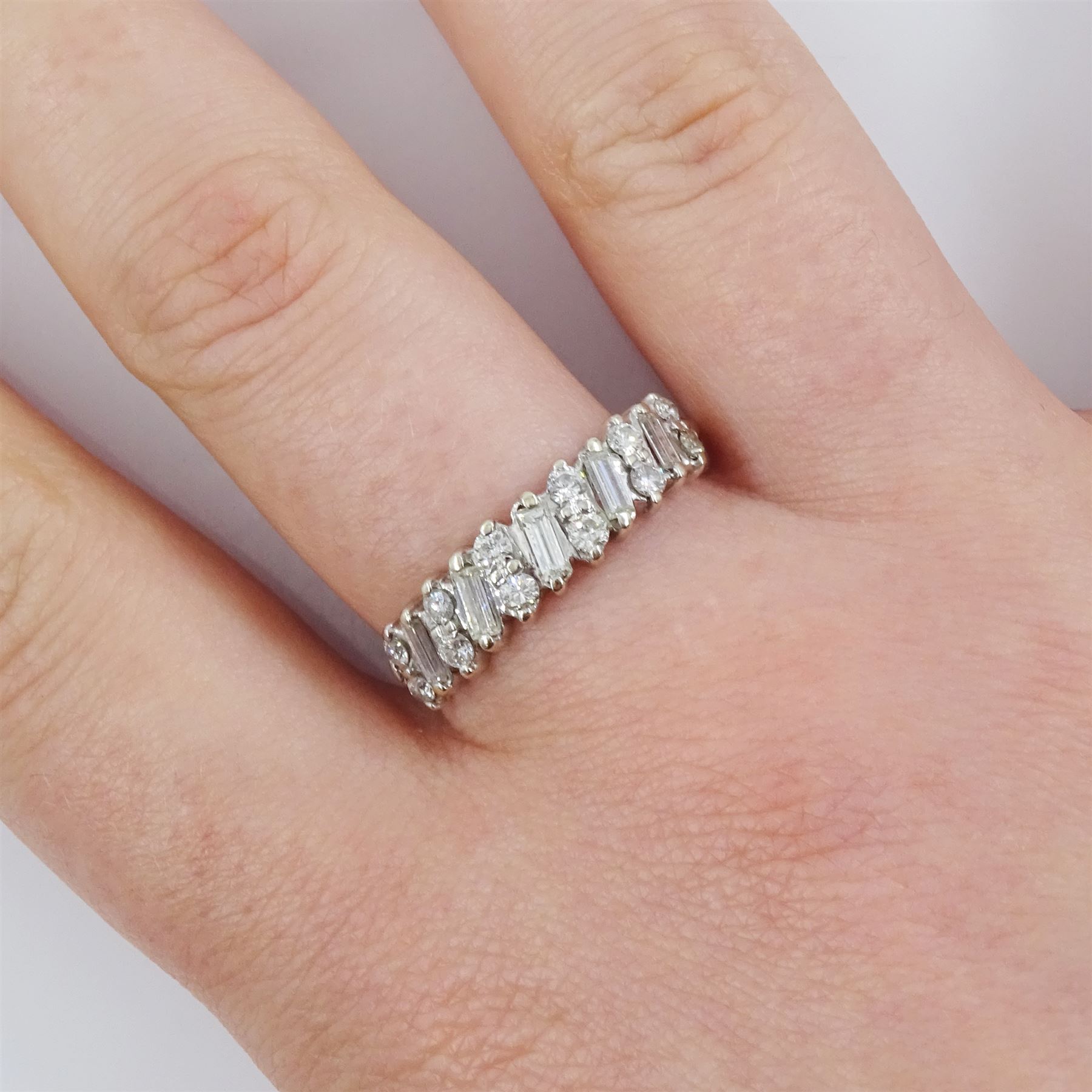 18ct white gold diamond half eternity ring, five baguette cut diamonds each spaced by two round brilliant cut diamonds, total diamond weight approx 0.55 carat