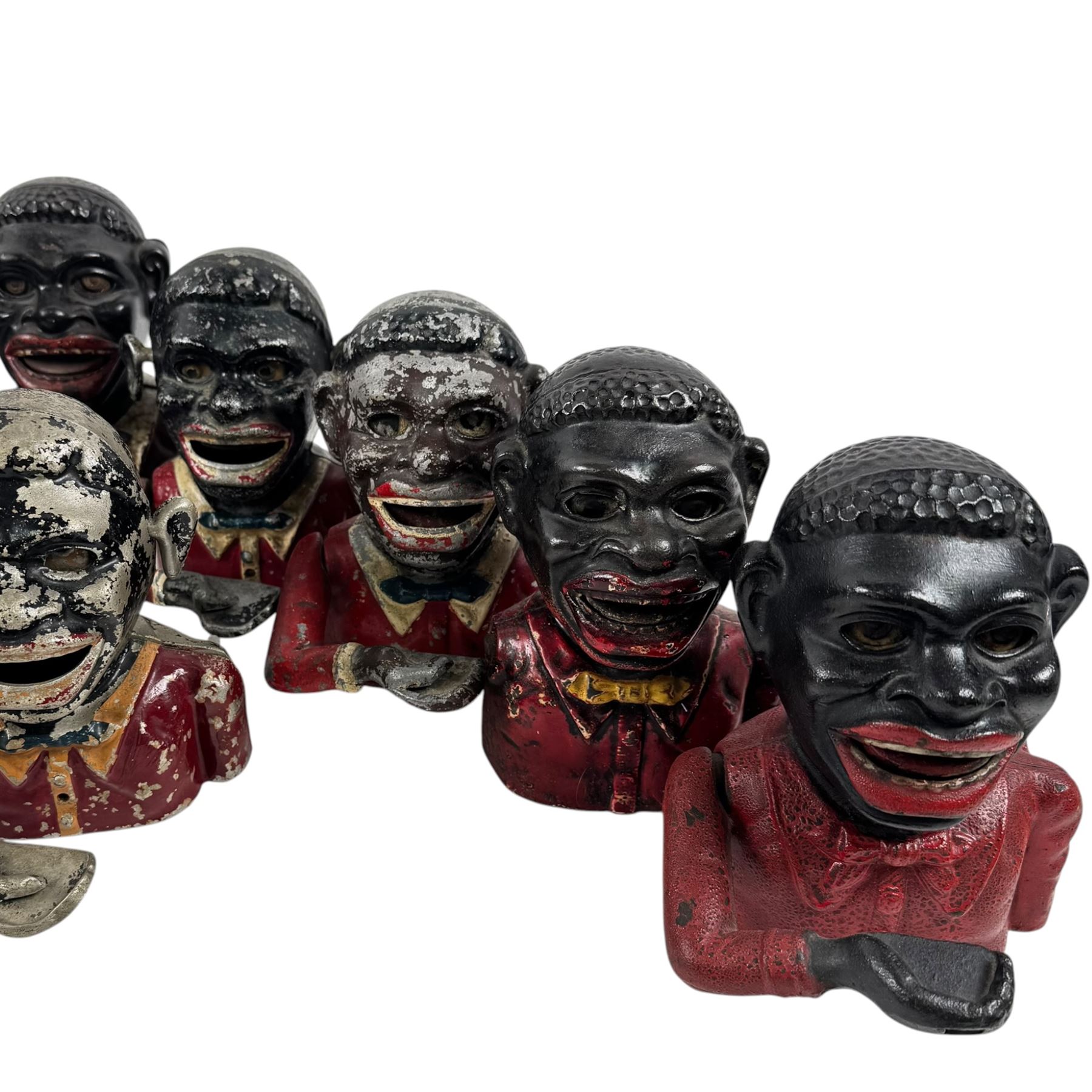 Collection of cast iron Jolly money boxes with and without hats