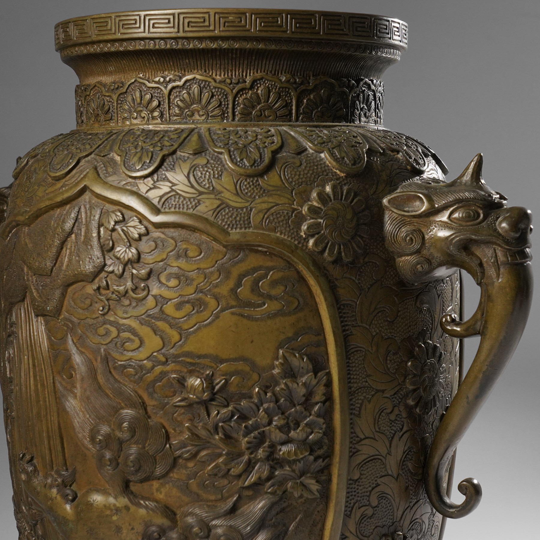 Japanese Meiji-Taisho period bronze vase, by Kanaya Gorosaburo, decorated with dragons and other creatures in a landscape, seal mark to base, H35.5cm 