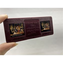 Two Stereofilms Bruguiere stereoscopes with seven boxes of related stereo positive slides to include one colour example entitled ‘Si Versailles m’etait conte’ Serie No.1, all in original boxes