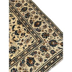 Persian Nain ivory ground rug, the field decorated with trailing leafy branches and palmettes, matching border within guard stripes