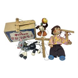 Pelham Puppet - three puppets comprising a painted wooden duck with felt mouth and wings with metal joints H12cm, in original box and instructions; and two further examples Type A cat with a hollow body H12cm, and a boy H23cm (3) 