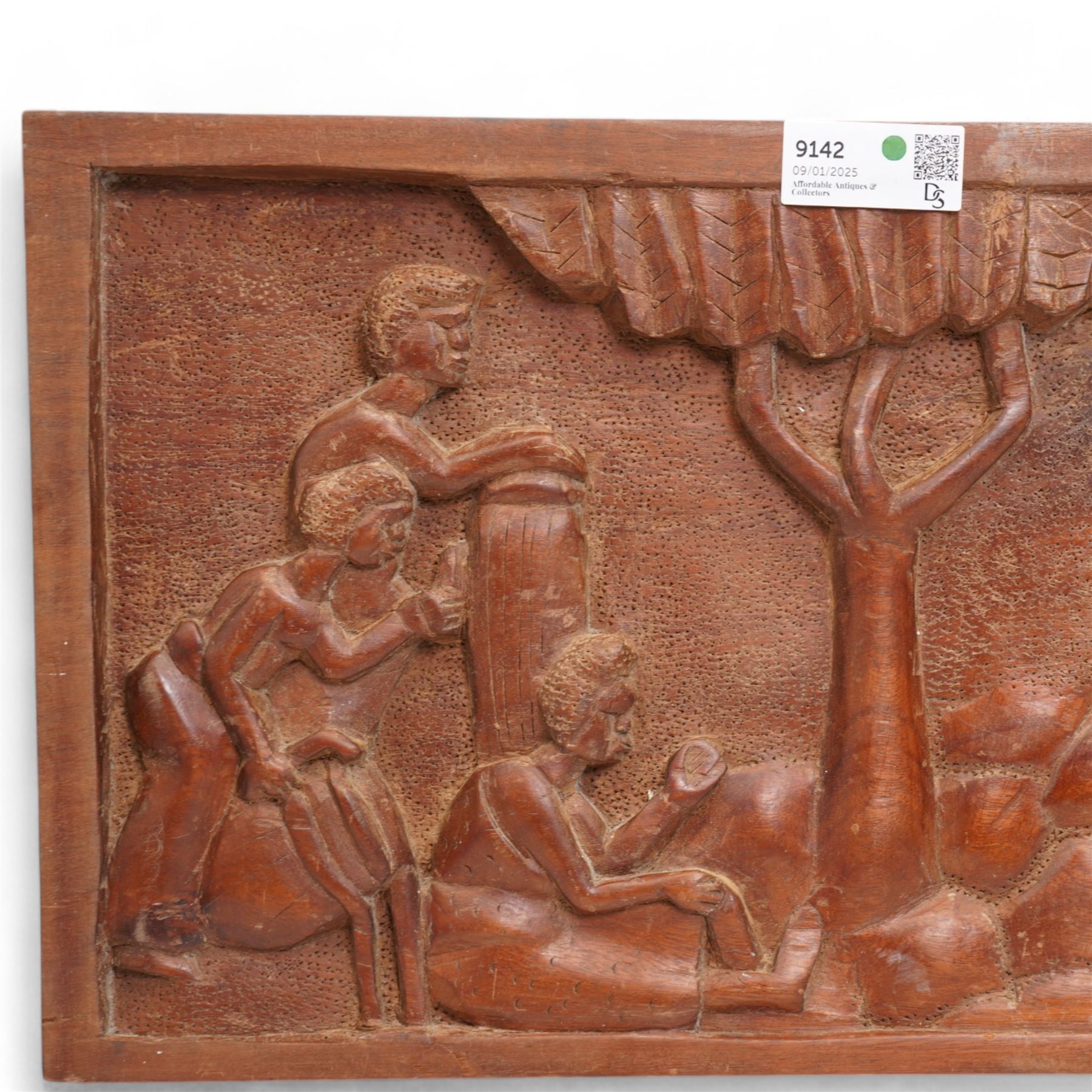  African carved wooden plaque with figures, tree etc 34cm x 81cm