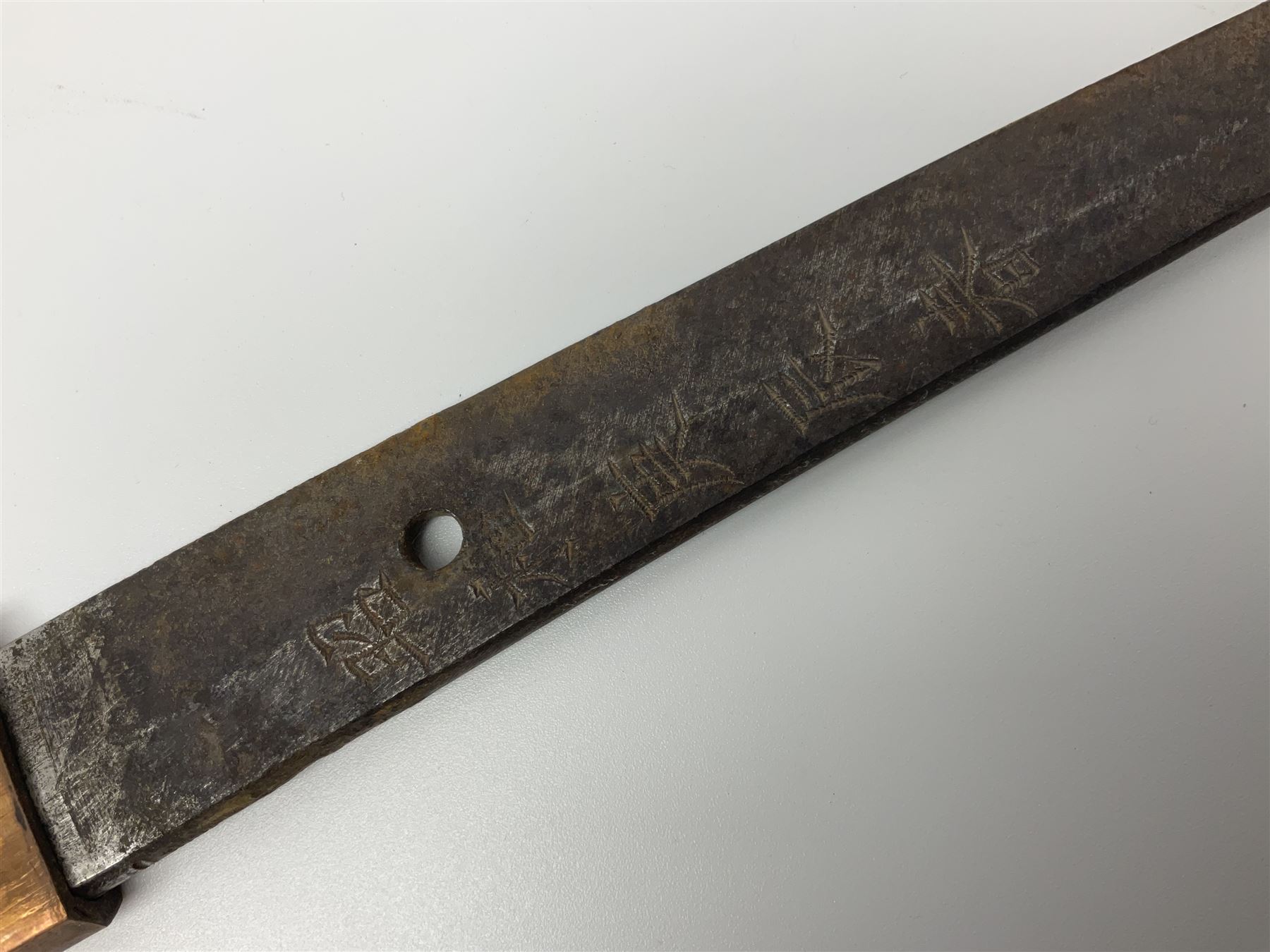 WW2 Japanese Army officer's shin gunto/katana sword with 68.5cm steel single edged blade, foliate cast brass tsuba, bound fish-skin grip with brass mounts, inscribed marks to both sides of tang; in lacquered wooden scabbard with brass mounts and locking button L97cm overall