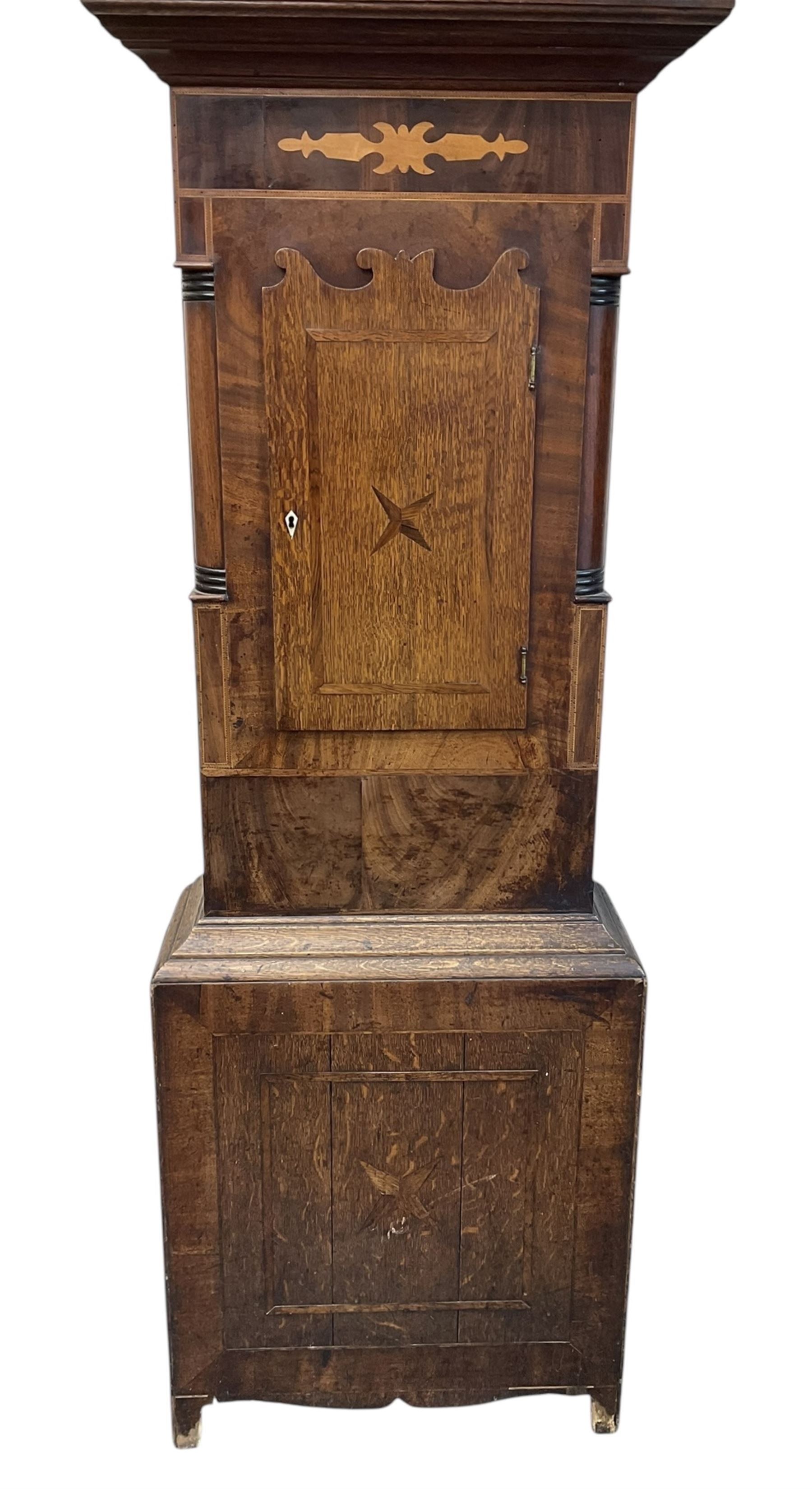D Hudson of Otley - late 19th century 30 hour oak and mahogany longcase clock, with a swan necked pediment, break arch hood door and ring turned pilasters, inlaid trunk with recessed columns and a short trunk door with inlay and a bone escutcheon, rectangular conforming plinth with a shaped base,  painted dial with geometric spandrels and a depiction of  Britannia to the arch, broad Roman numerals, makers name and calendar dial, dial pinned directly to a chain driven countwheel striking movement, striking the hours on a bell. with pendulum. No weight or movement seat board.