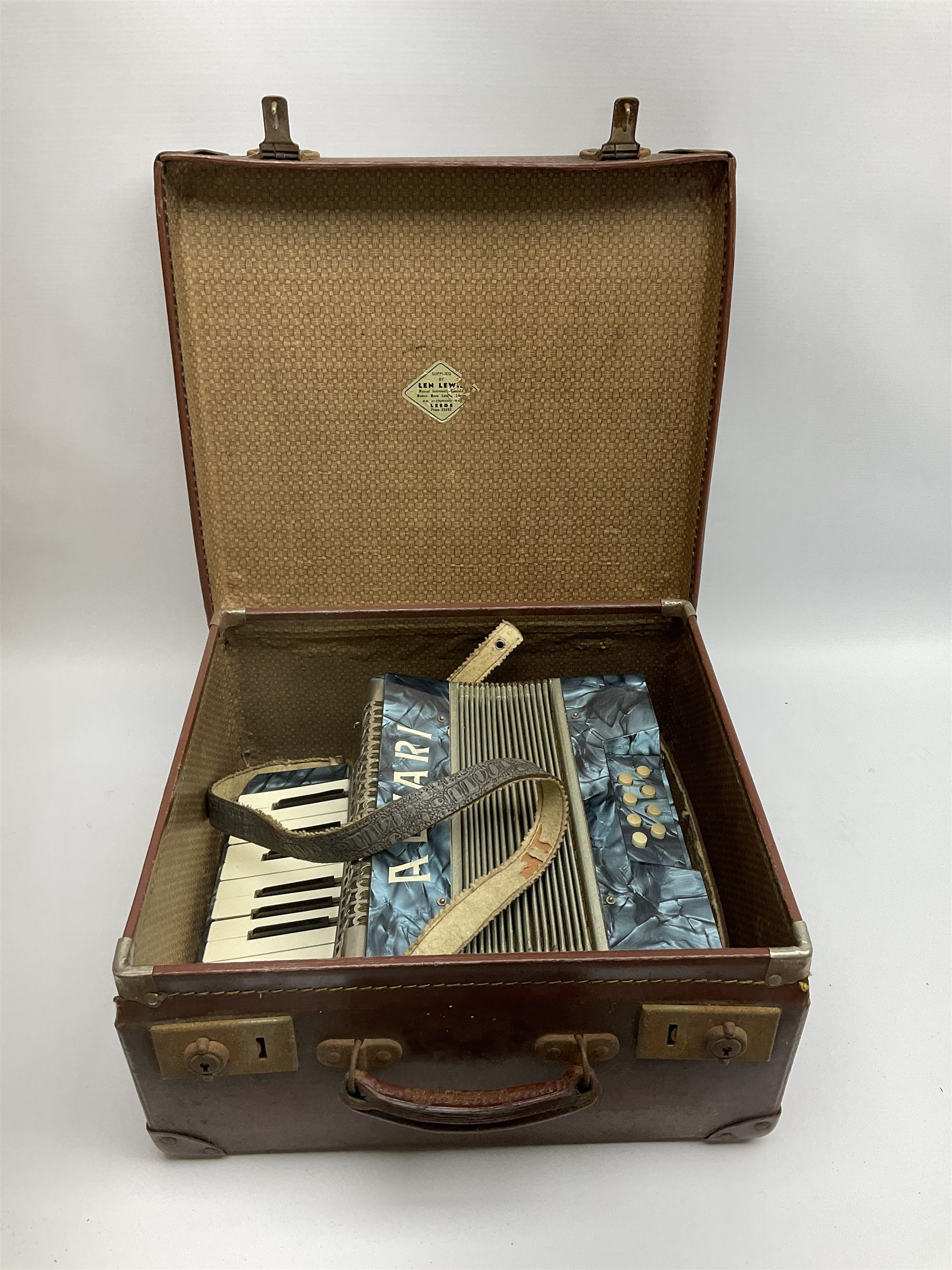 Small German Alvari piano accordion with blue pearline case, thirteen keys and eight buttons L30cm; in carrying case
