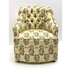 20th century button backed tub shaped bedroom chair upholstered in vintage floral fabric on yellow ground