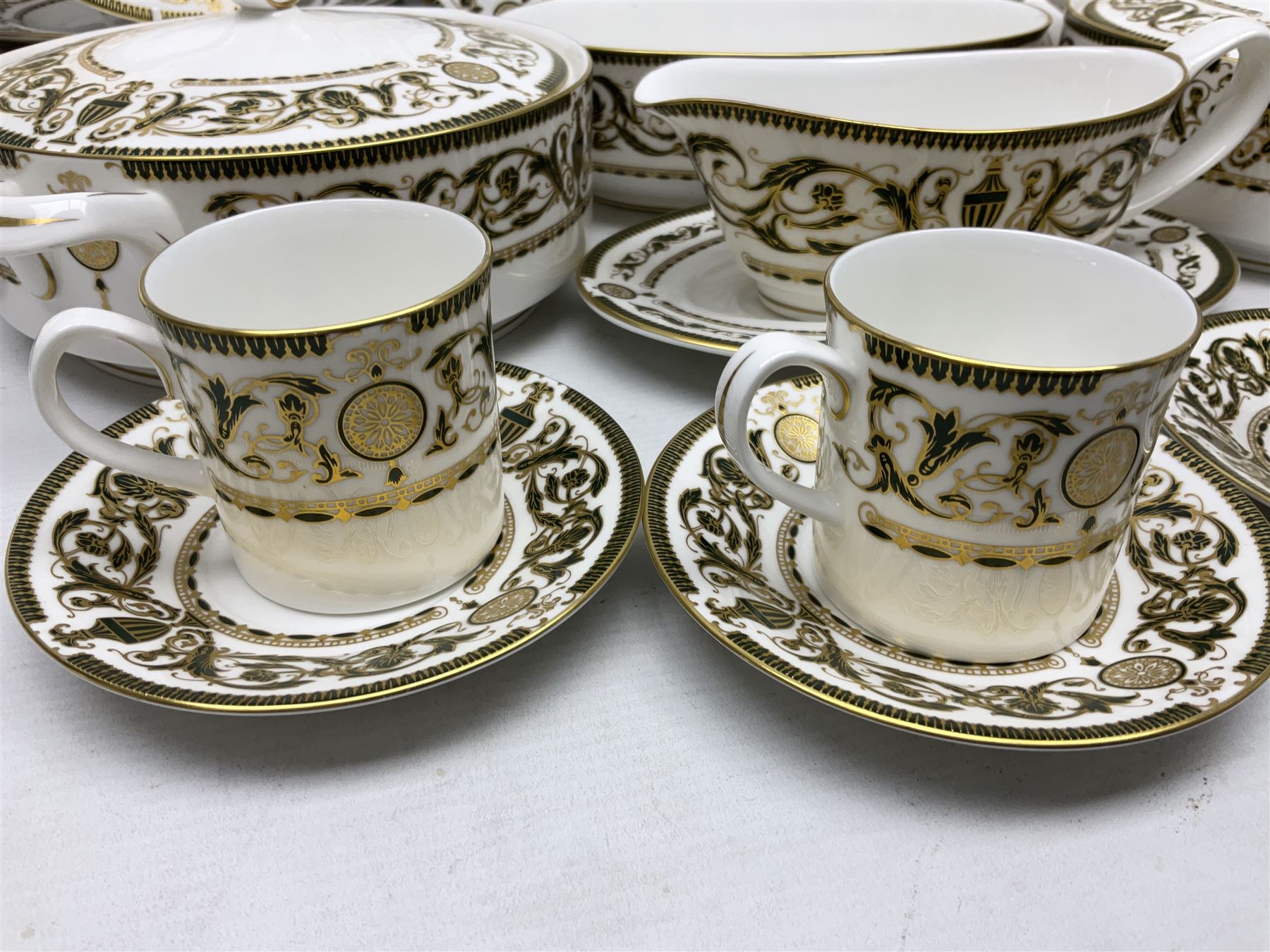 Royal Worcester Windsor pattern part tea and dinner service, comprising nine dinner plates, nine side plates, nine dessert plates, six coffee cans and saucers, sauce boat and plate, two covered tureens, oval dish and serving platter (35)