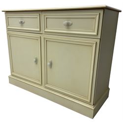 20th century cream painted side cabinet or sideboard, fitted with two drawers over two cupboards, on skirted base