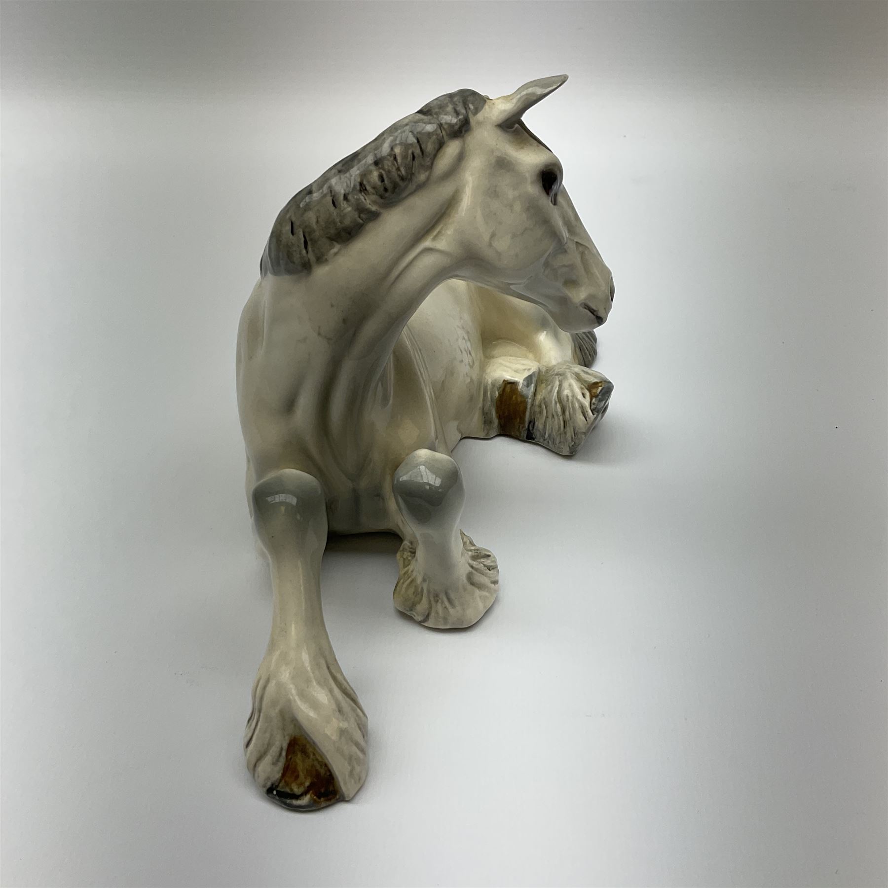 Beswick dapple grey Shire horse lying down model no 2459, with printed mark beneath. 