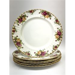 Royal Albert Old Country Roses part dinner and tea service comprising teapot, four tea cups and saucers, eight dessert plates, cake plate, cake stand, a tureen with cover, six dinner plates, an oval dish, two trinket dishes, bell and shoe decoration. 