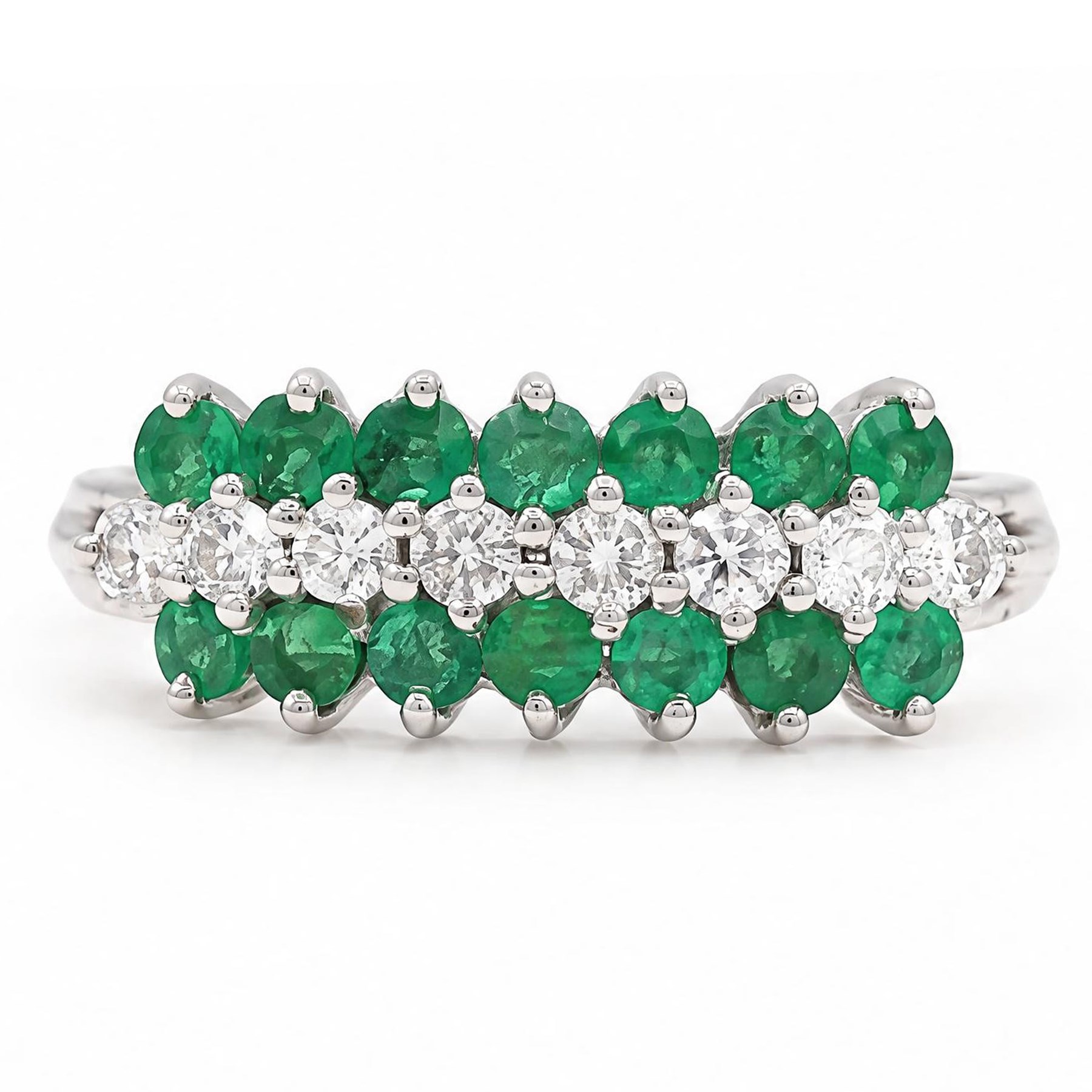 18ct white gold three row diamond and emerald ring, set with eight round brilliant cut diamonds and a row of seven emeralds set either side, total diamond weight approx 0.30 carat