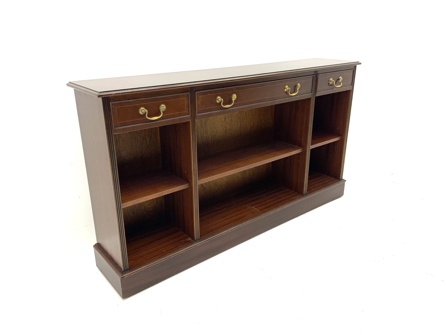 Sydney Smith - mahogany sideboard, cross banded and inlaid detail, three short drawers above three adjustable shelves, raised on platform base