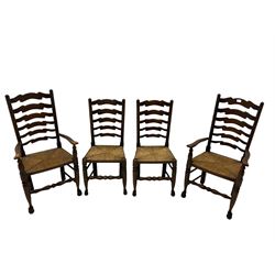 Set of four quality elm ladder back dining chairs, comprising two carver armchairs and two side chairs, with rush seats