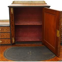 19th century French inlaid figured walnut and ebonised Bonheur de Jour or writing desk, the raised upper section with pierced brass three-quarter gallery, over a mirror glazed cupboard and a combination of drawers, the shaped and moulded top with leather inset and satinwood stringing, with brass beading too the ebonised edge, fitted with a serpentine fronted frieze drawer, raised on cabriole supports, inlaid throughout with scrolling foliate decoration in boxwood and ornate cast brass mounts and handles