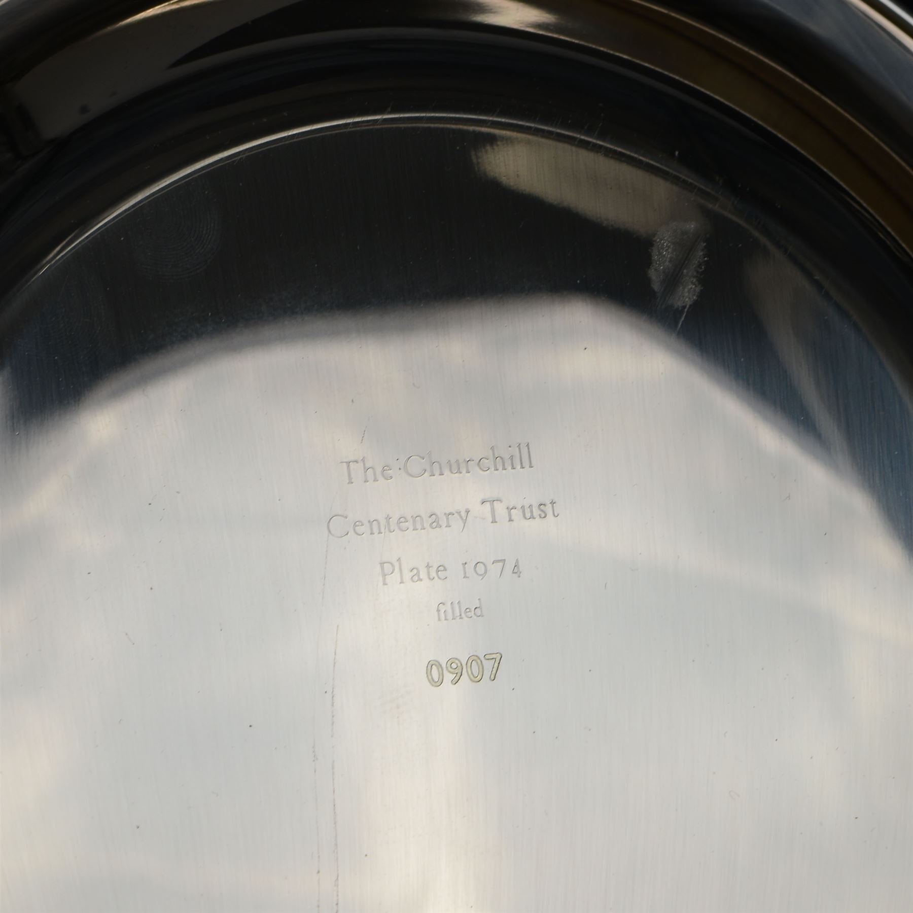 Limited edition silver filled The Churchill Centenary Trust plate, of circular form decorated in low relief with a portrait of Winston Churchill in 24ct gold, hallmarked John Pinches, London 1974, contained within wooden display frame with velvet interior, plate D20.5cm