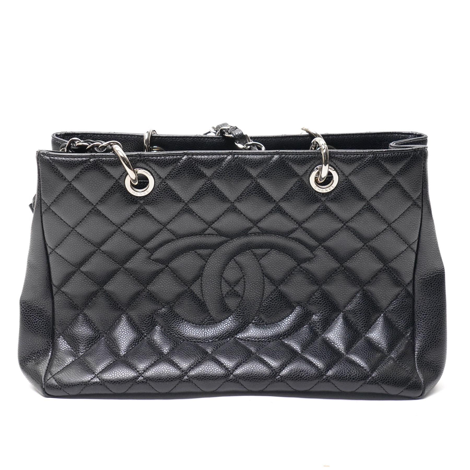 Chanel - black GST Grand Shopping Tote, caviar leather with classic diamond quilting and large embroidered CC logo to the centre front, with polished silver-tone hardware, a rear patch pocket, chain and leather handles, and an open top with three main interior compartments, 2009-2010, serial number 13547470
