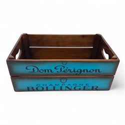 Three-piece champagne advertising display set, comprising pine steps with painted Dom Pérignon and Bollinger lettering, and two wooden boxes branded Moët & Chandon and Veuve Clicquot (Steps H 80cm, W 44cm, D 68cm, crates each H 18cm, W 44cm, D 26cm)