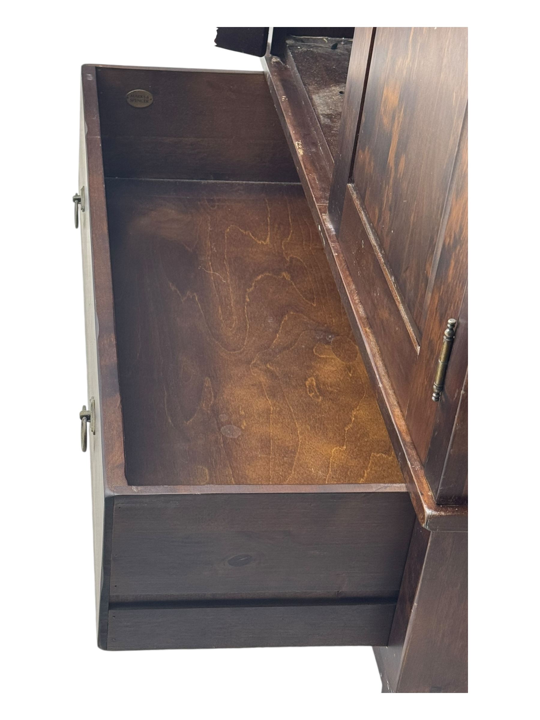 Marks & Spencer - dark wood double wardrobe, fitted with single drawer, on turned feet