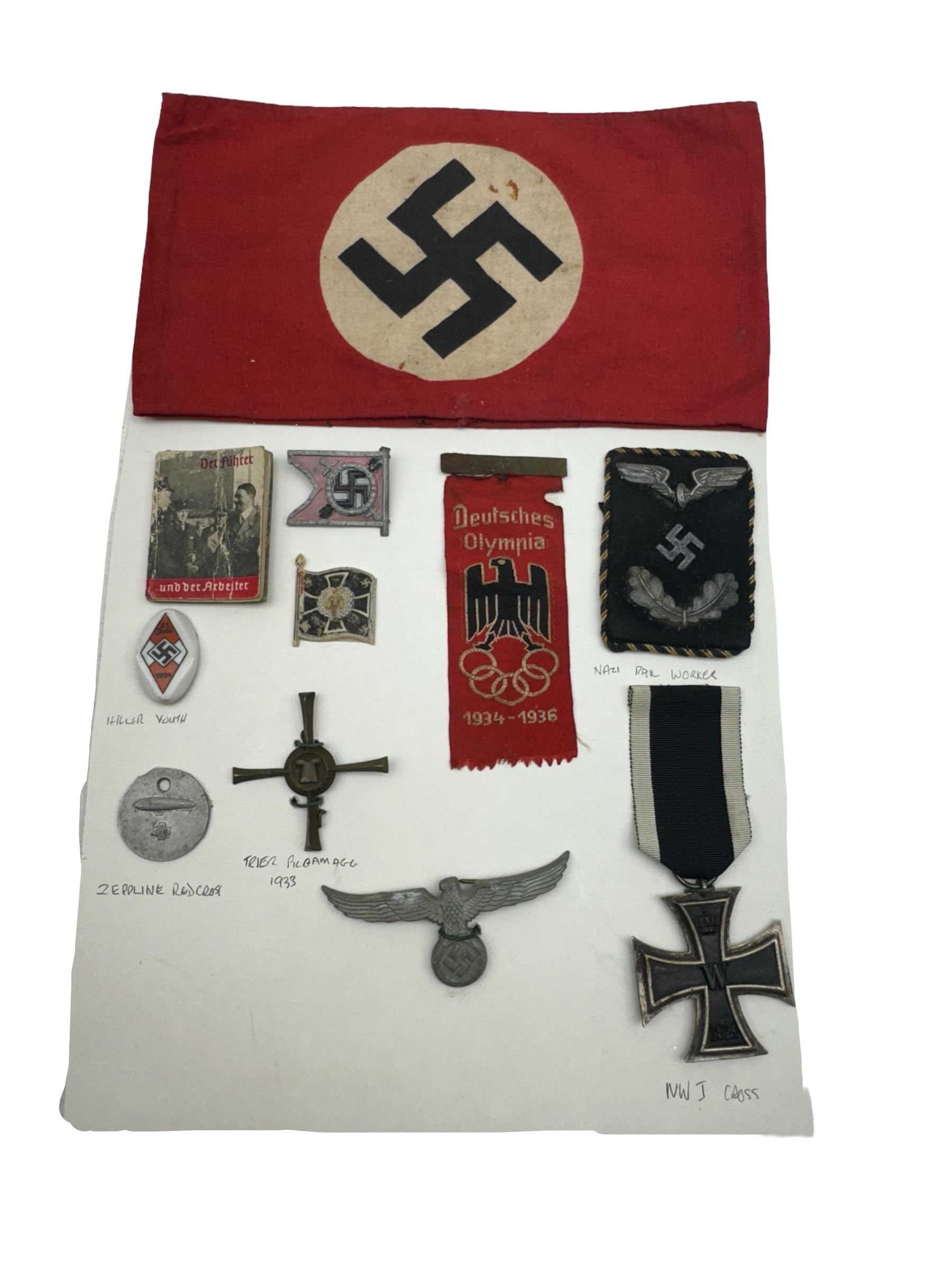 WWII Iron Cross, together with Hitler Youth pin, NSDAP arm band, Deutsches Olympia silk badge and other German insignias 