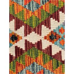 Chobi kilim multi-colour ground runner, the field decorated with lozenges and geometric patterns, within hooked border 
