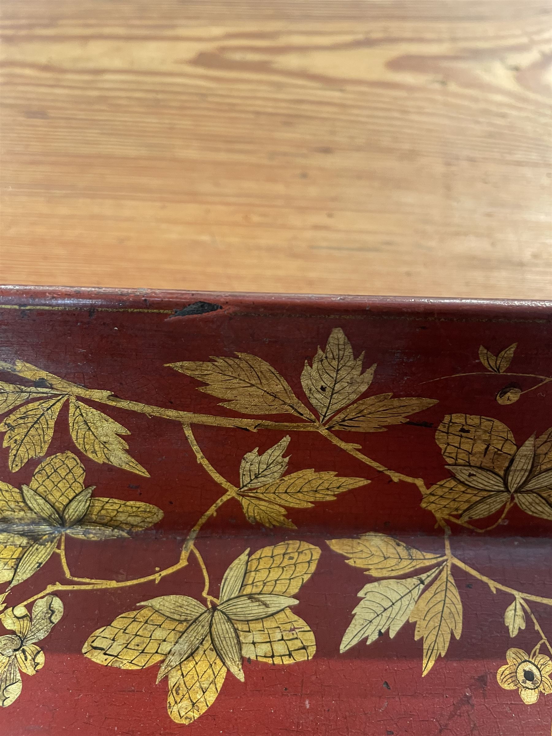 Early 19th century red lacquered papier-mâché tray by Clay of King Street Covent Garden, of rounded rectangular form, painted in gilt with large foliate sprays and butterflies, impressed verso CLAY KING ST COVENT GARDEN, W66.5cm D48.5cm