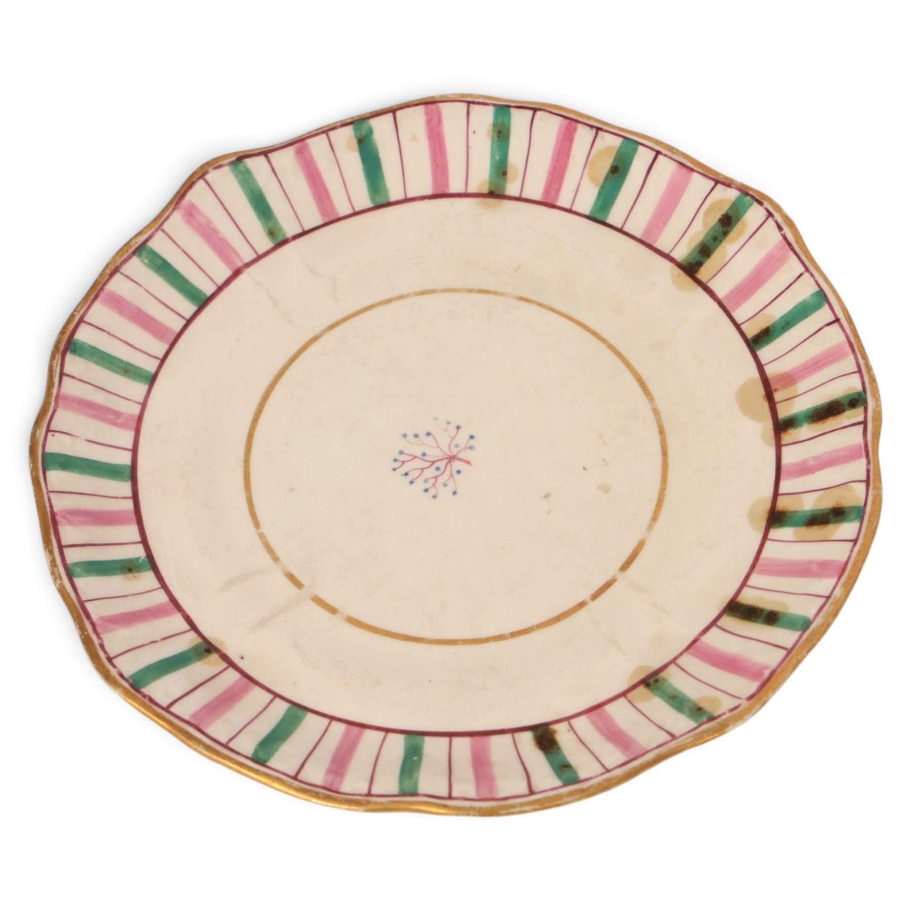 Late 19th century tea service, decorated with a green and pink strips, with internal decoration of budding branch within a gilt band upon a white glazed ground, comprising  twin handle lidded sucrier, milk jug, three serving plates, nine cups and saucers and four teacups