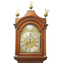 18th century oak eight-day longcase clock,  signed James Smyth, Saxmundham, the arched hood with brass ball and eagle finials, moulded arch pediment over turned columns, brass dial with silvered Roman chapter ring, Arabic minute track, matted centre with subsidiary seconds dial and calendar aperture, engraved boss to arch, the trunk with arched panel door, on stepped plinth base, with two weights and pendulum
