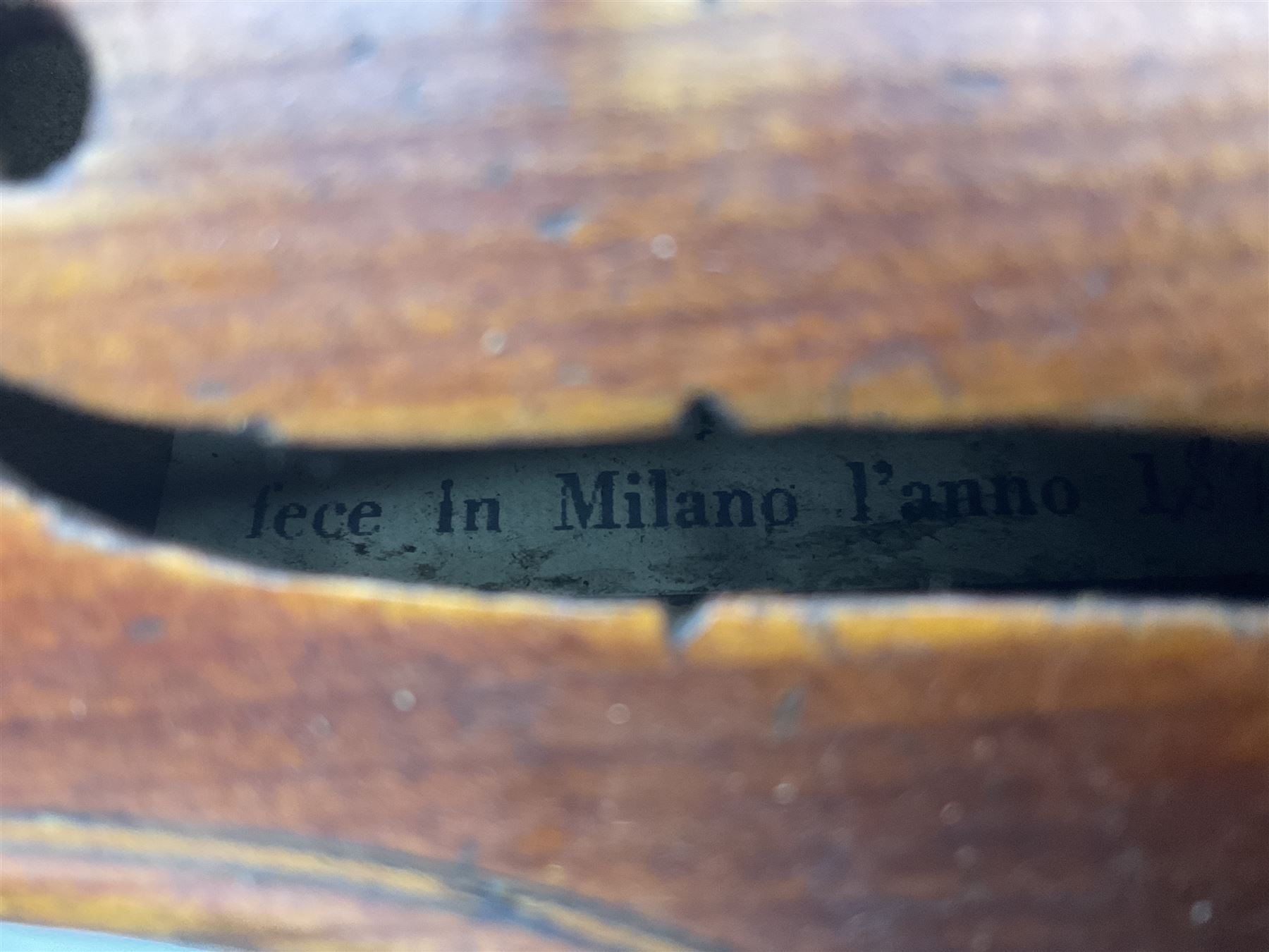 Mid-19th century German violin with 36cm two-piece maple back and ribs and spruce top, bears label 'Riccardo Antoniazzi Cremonese fece in Milano l'anno 1896' L59.5cm overall; in walnut case with two part bows