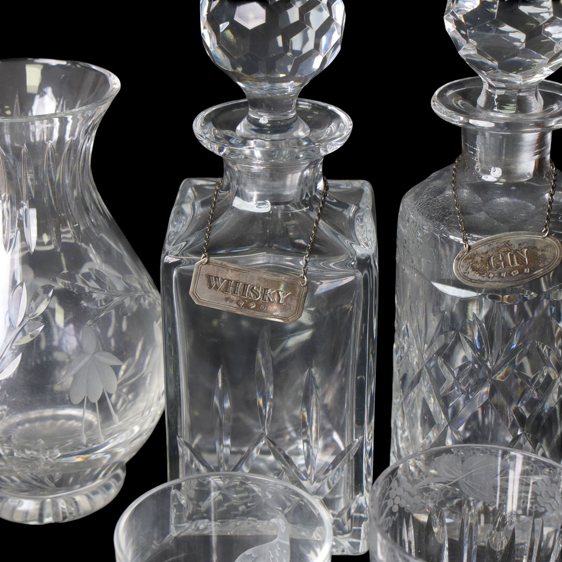 Four glass decanters with three silver labels for gin sherry and whisky, hallmarked Birmingham 1984, together with two Stuart Crystal vases and set of four Galloway glasses