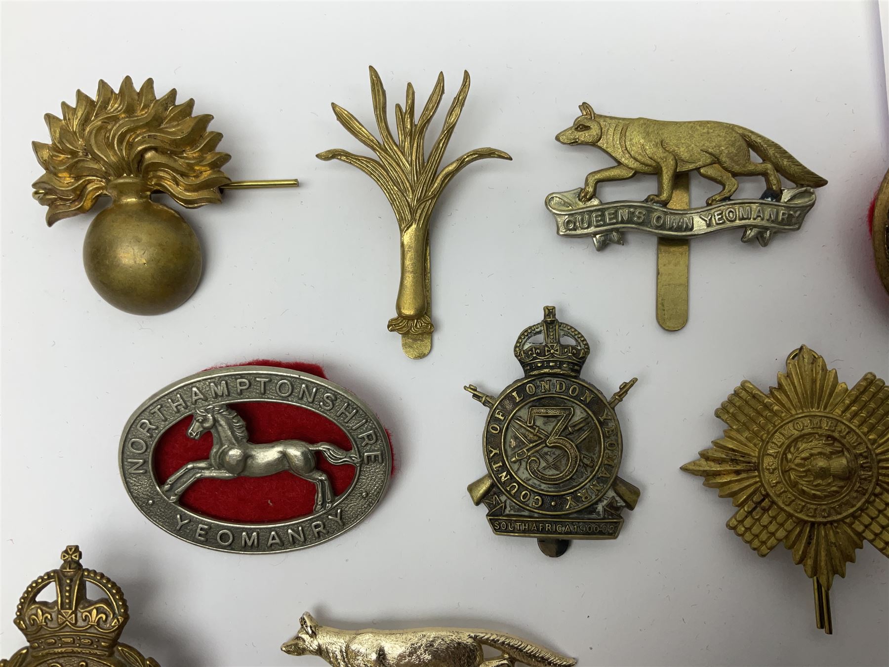 Twenty-six cap badges for Yeomanry and various guards including Fife & Forfar, Lothian and Border Horse, Leicestershire, Northamptonshire, Queens Own, Coldstream, Grenadier, Machine Gun Regiment, Life Guards etc (26)