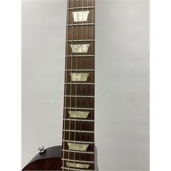 2012 American Gibson Les Paul Studio electric guitar, retro fitted with iron gear pick-ups, push-pull 'pots', roller bridge, string butler and locking machines, serial no.115321594, L99cm overall; in Gibson soft carrying case.