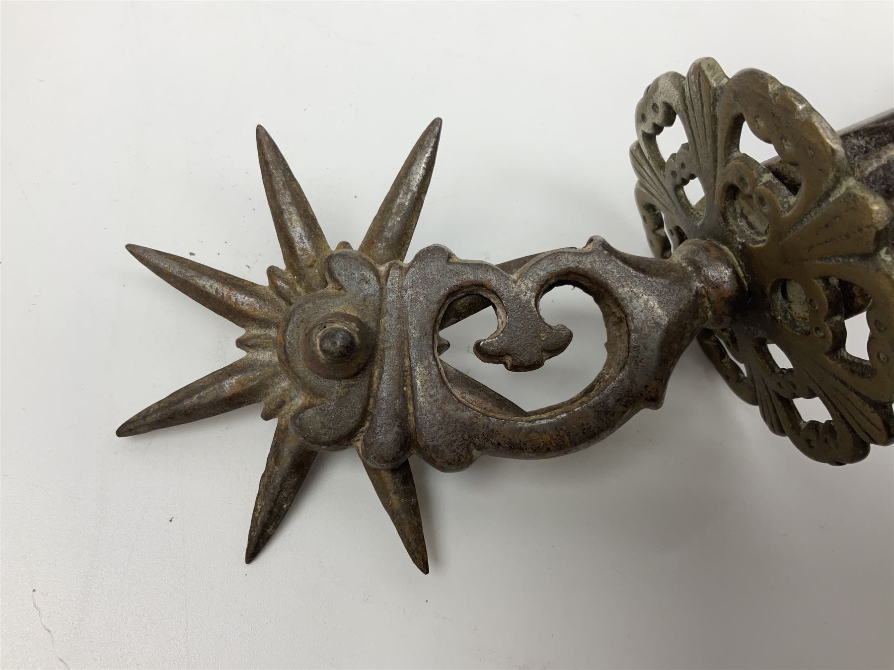 Pair of South American gaucho steel and brass spurs with eight-spike heel rowels, possibly Chilean L25cm