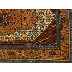  Iranian ivory ground wool rug, central hexagonal medallion, 175cm x 122cm  