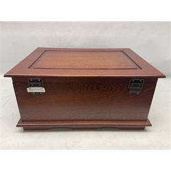 Waltmann und Sohn part canteen of stainless steel and gilt cutlery, the stained wood case with hinged lid above two fitted drawers, L48cm