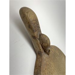 'Mouseman' oval oak cheeseboard, the knotty handle carved with mouse signature, by Robert Thompson of Kilburn