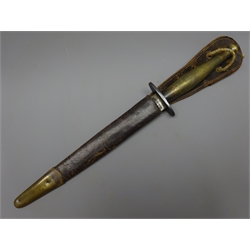  Fairbairn Sykes 2nd Pattern Fighting Knife, 16.5cm twin edged blade, etched 'Wilkinson Sword Co. London, The F-S Fighting Knife', steel cross guard and brass chequered grip, L29cm, leather scabbard   