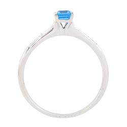 18ct white gold blue topaz and diamond ring, the single emerald cut topaz of approx 0.65 carat, each shoulder set with five, channel set princess cut diamonds