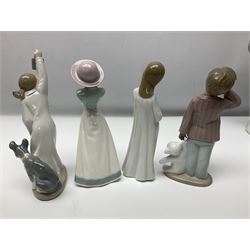 Eleven Nao figures to include Cowboy, Girl with Puppy, Clown, Girl in hat etc 