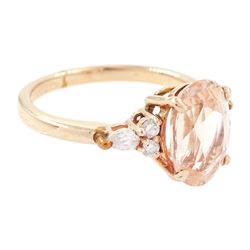 14ct rose gold pink / peach sapphire and diamond ring, single oval cut sapphire of 3.07 carat, with two round brilliant cut diamonds and a pear cut diamond set either side, stamped, total diamond weight 0.11 carat, with Gem Lab report